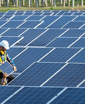 A man replacomg solar panels